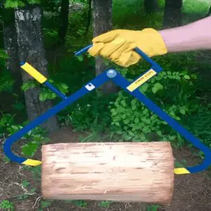 Log lifter tool holding a wooden log.